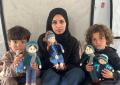 Gaza, Shireen Al-Kurdi weaves joy for children in the Strip by making crochet dolls inside a tent